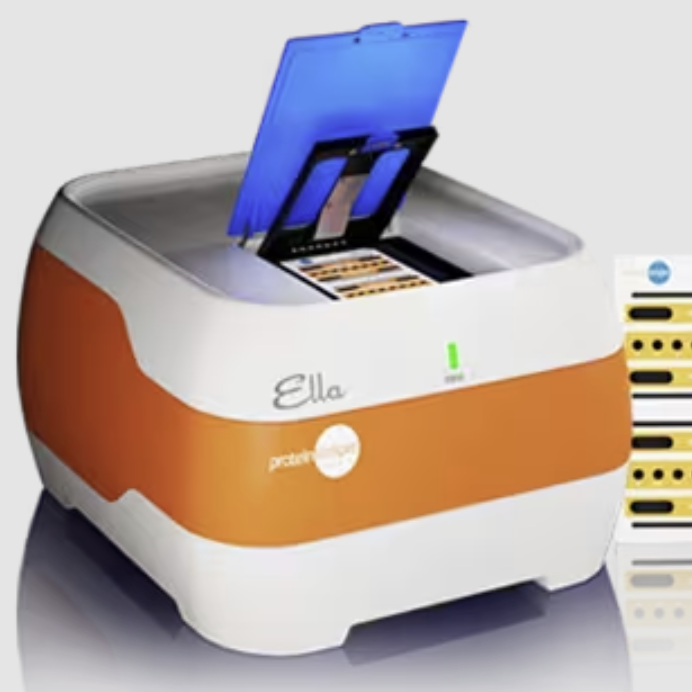 The Ella machine. An orange and white cube with testing material inside and on the right of the image.